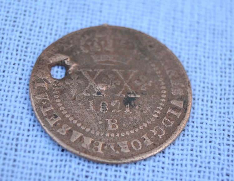 Moeda real da Coroa Portuguesa, 1821. Peça encontrada no sítio arqueológico da antiga casa, já demolida, onde viveu Esperança Garcia